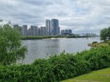 View across a wide river toward a modern Chinese skyline with tall buildings – a glimpse into Jan Wengryn’s life during his assignment abroad.